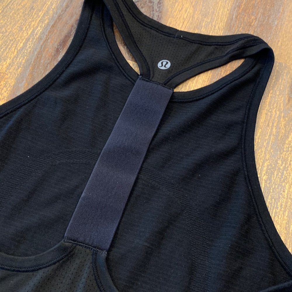 Lululemon workout top. Size 4. Tag removed; see photos for measurements.